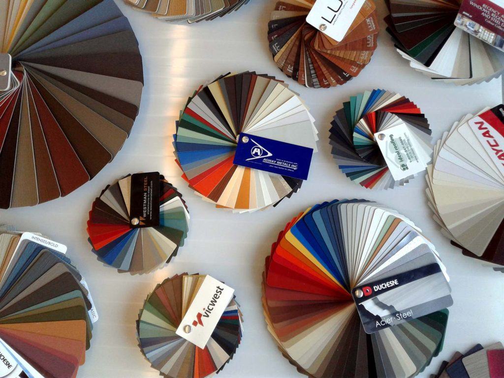 fan decks showcasing colours spread out on table