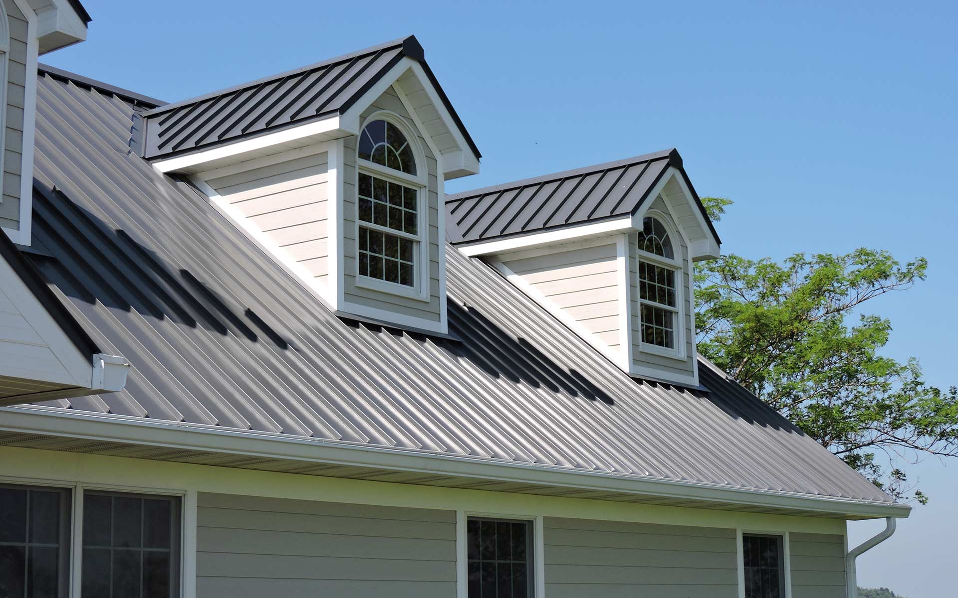 grey trim on roof of house with two windows