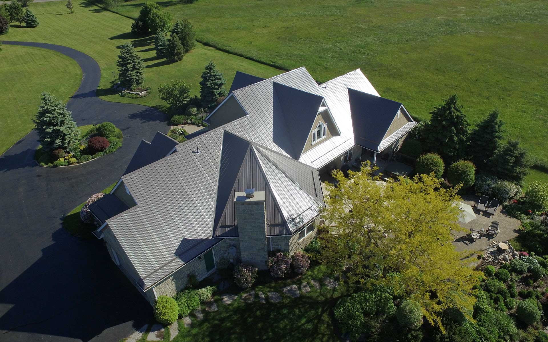 aerial view of large home with grey trim
